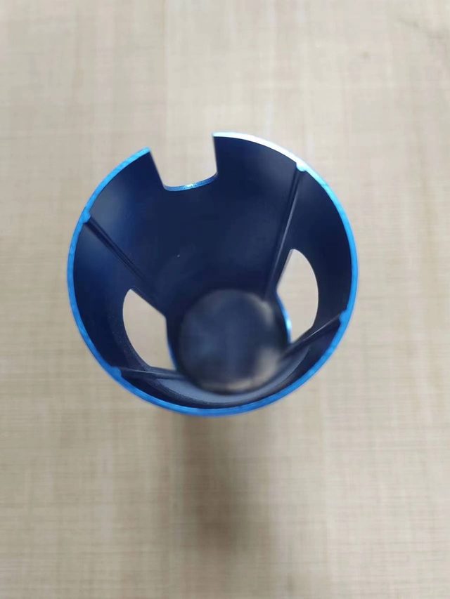 Blue anodized aluminum part with an even finish across the inner and outer surfaces