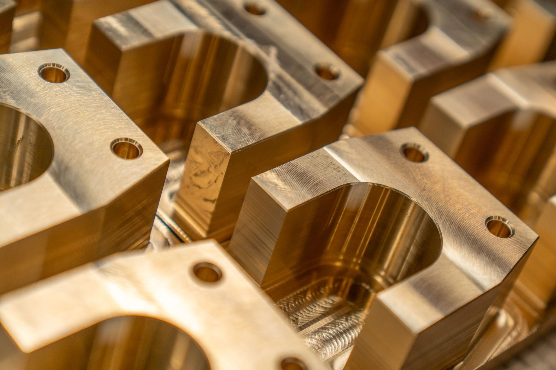 CNC-machined aluminum part with bores and threaded holes