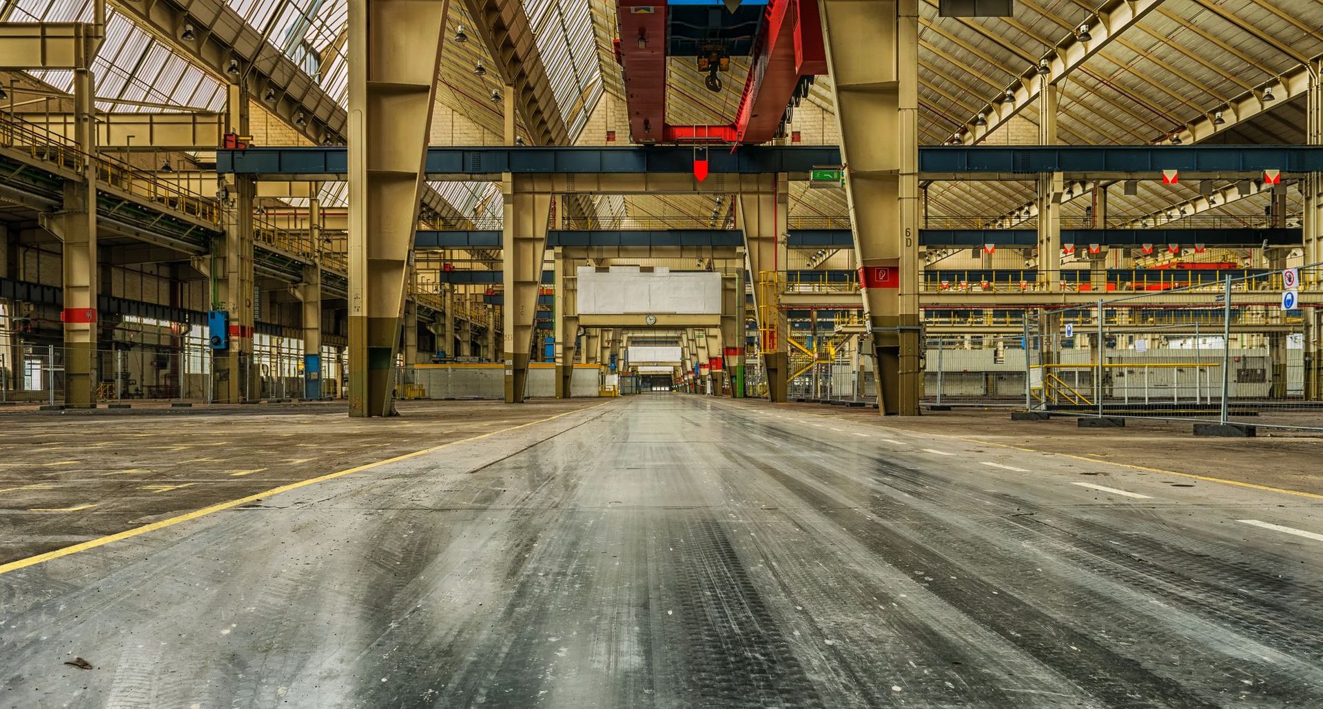 Industrial warehouse floor and overhead cranes